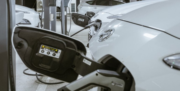 A row of electric cars being charged