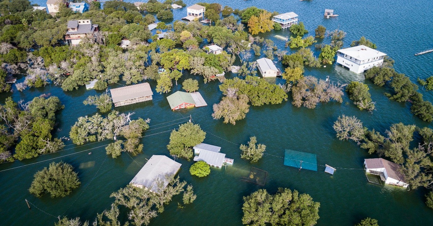 Aerial drone views of multiple houses half under water due to flooding